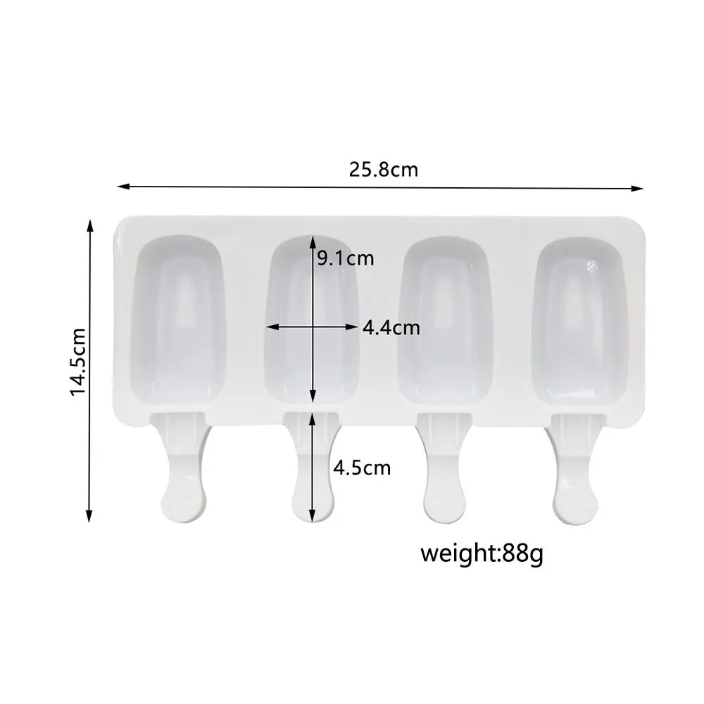 A white silicone mold with four oval cavities for making popsicles or ice cubes.