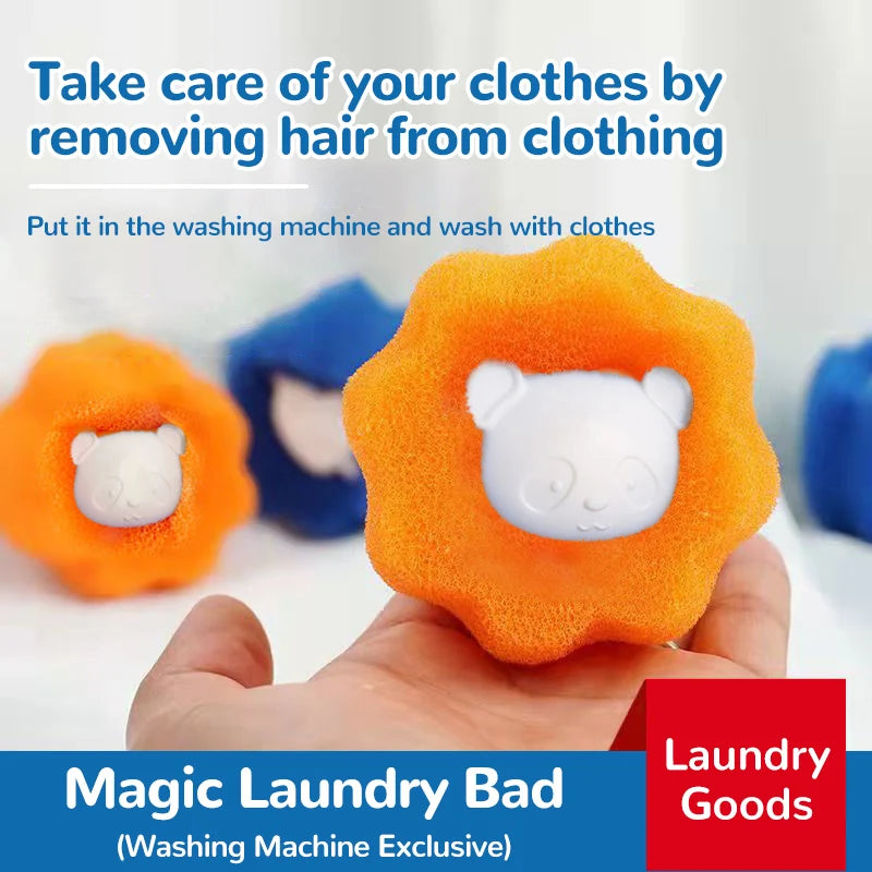 A hand holds an orange laundry ball with a white panda face, used for removing hair from clothing.