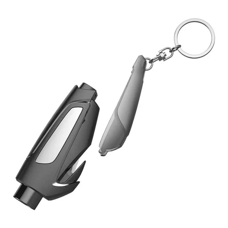A compact car emergency escape tool with a window breaker and seatbelt cutter attached to a keyring.