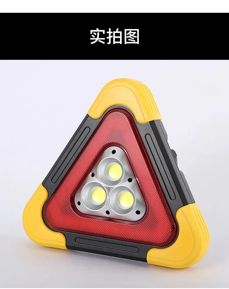 A triangular warning light and flashlight assembly with a yellow and black casing is shown.