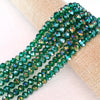Green faceted crystal glass spacer beads strung on natural twine for jewelry making
