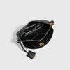 A black leather tote bag with gold-toned hardware and a flap closure.