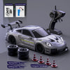 A silver RC drift truck model is shown with accessories like charging cables, racing tires, and a triangular barrier.