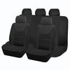 A set of four black car seat covers shown side-by-side.