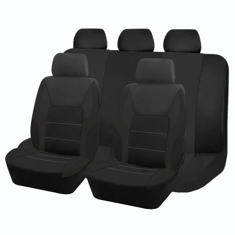 A set of four black car seat covers shown side-by-side.