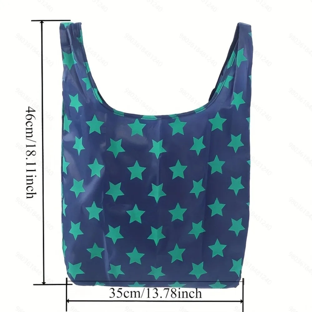 A dark blue tote bag with a pattern of green stars, shown flat.