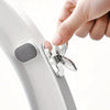 A hand is lifting a toilet seat using the flush button mechanism on a white toilet.
