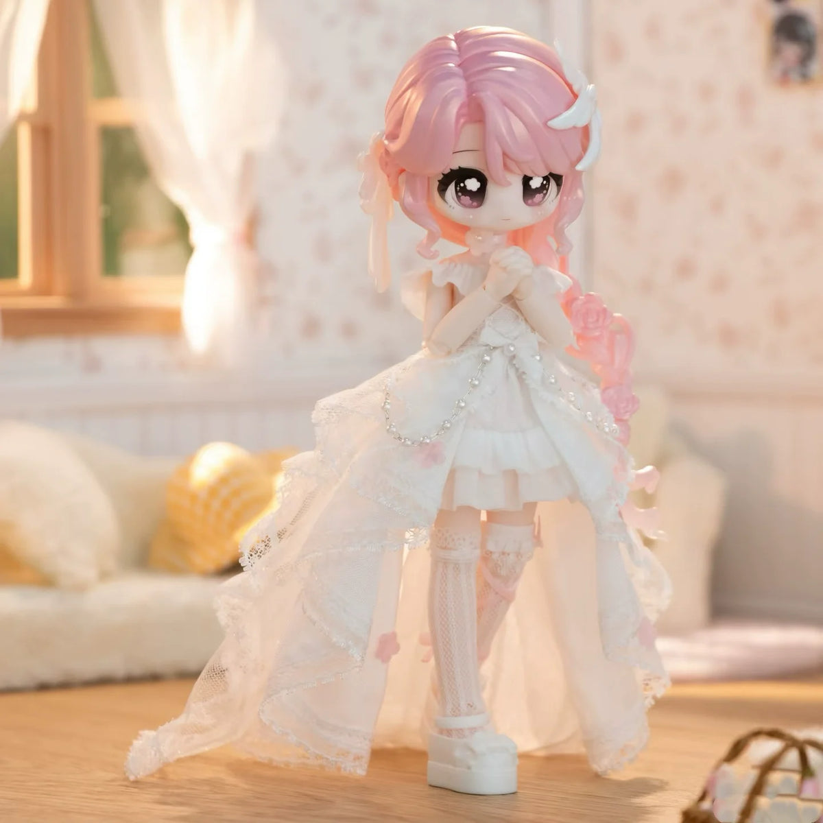 A pink-haired Articulated BJD collectible figurine wearing a white lace dress in a soft indoor setting.