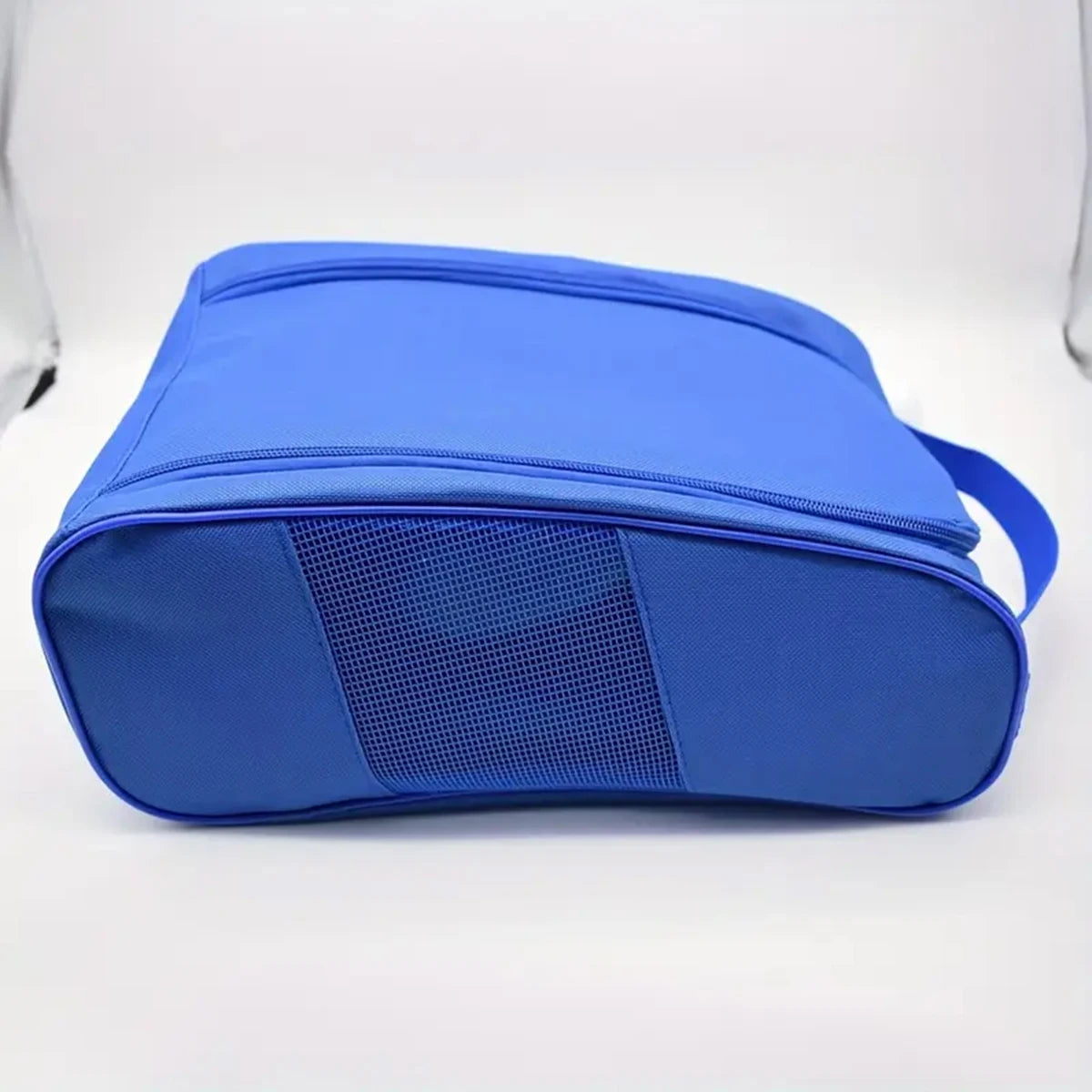 A bright blue breathable oxford cloth shoe storage bag shown from the side.
