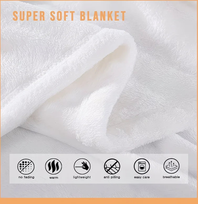 A white super soft blanket folded and draped, showing a fluffy texture.