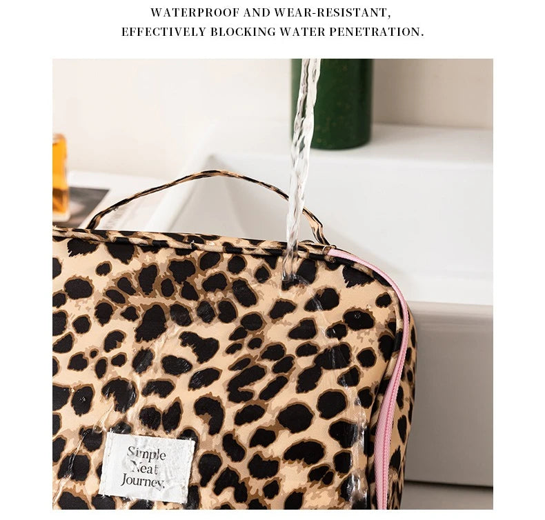 A leopard print toiletry bag is shown with water running over it, demonstrating its waterproof and wear-resistant features.