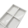 White plastic drawer organizer tray with six compartments for dental instruments