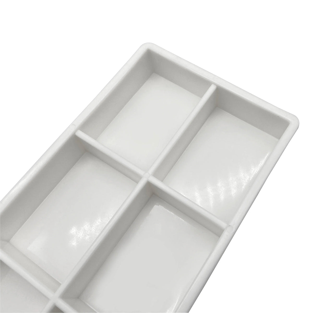 White plastic drawer organizer tray with six compartments for dental instruments