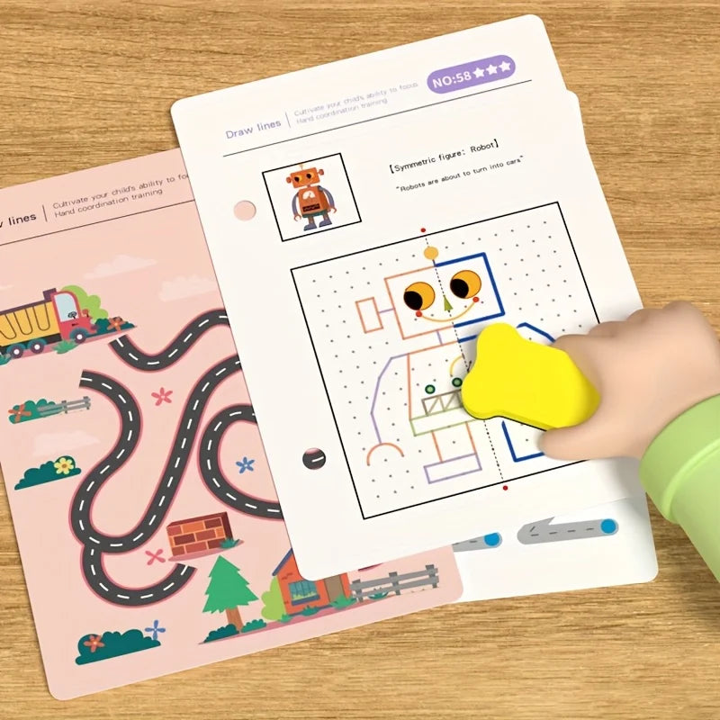 A hand is drawing lines on a worksheet with a figure of a robot and other shapes for tracing practice.
