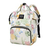 A light-colored waterproof diaper bag backpack with floral patterns and black straps.