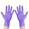 Pair of purple disposable nitrile gloves shown on a hand.
