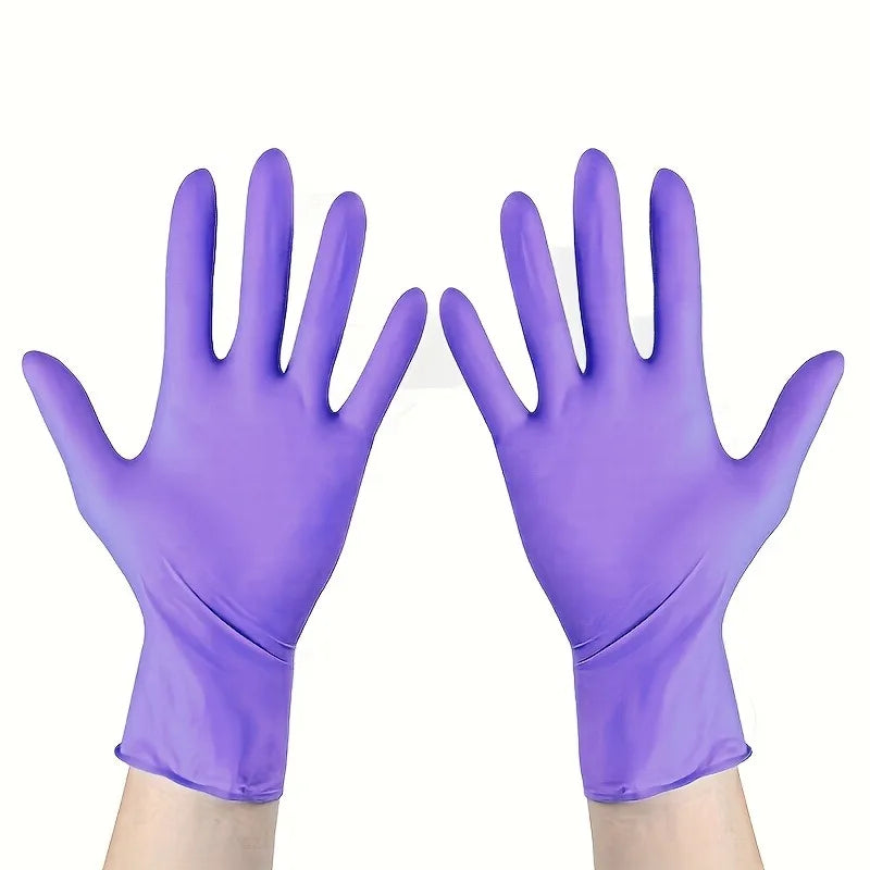 Pair of purple disposable nitrile gloves shown on a hand.