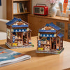 A detailed miniature Japanese book nook kit featuring a traditional storefront with lighting and wooden elements.