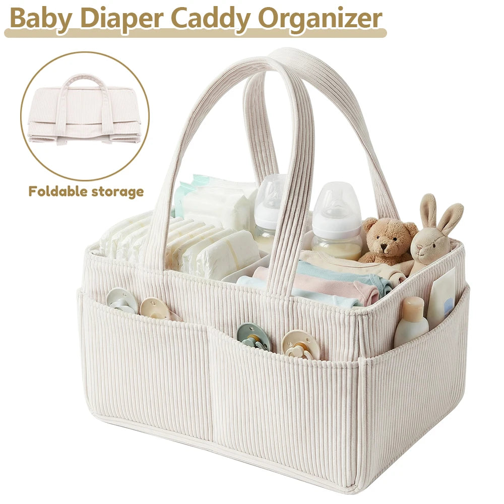 A beige corduroy baby diaper caddy organizer with handles showing various baby supplies like diapers and bottles.