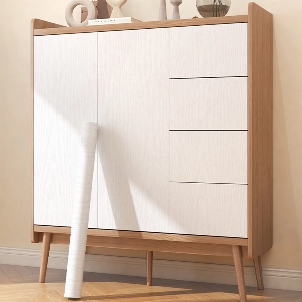 A light wood grain cabinet with white doors and drawers, featuring a natural finish.