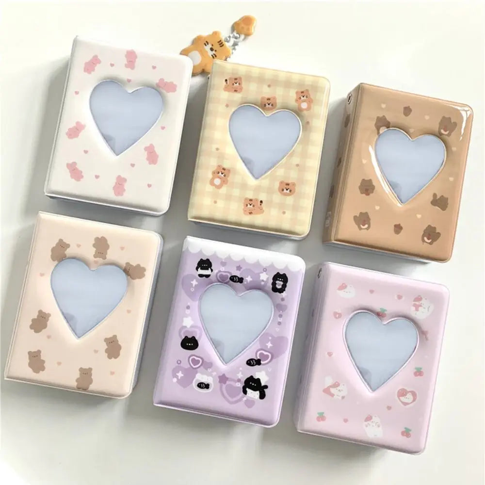 A collection of six square photo albums with heart cutouts featuring various pastel colors and bear designs.