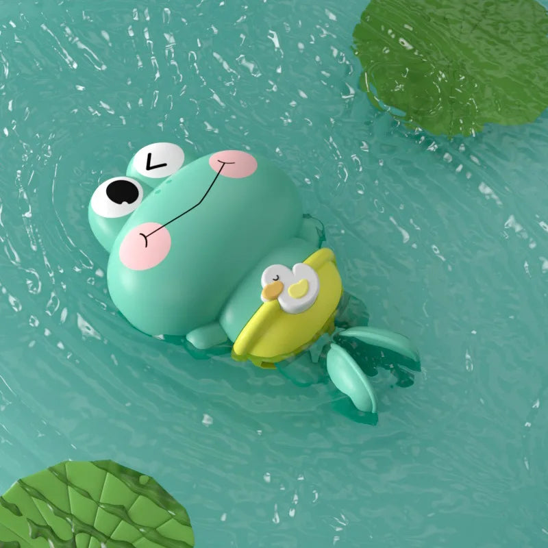 A cute cartoon turtle toy floating in blue water with green leaves visible around it.