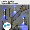 A smart night light is installed on a staircase wall, illuminating the area with balanced brightness.
