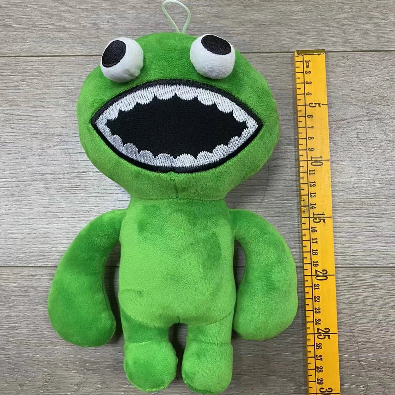 A bright green plush toy resembling a cartoon bird with large eyes and an open mouth.