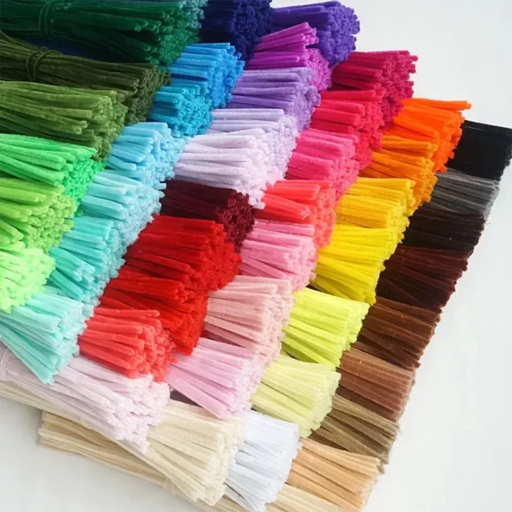 A collection of colorful chenille craft stems in various shades arranged in rows.