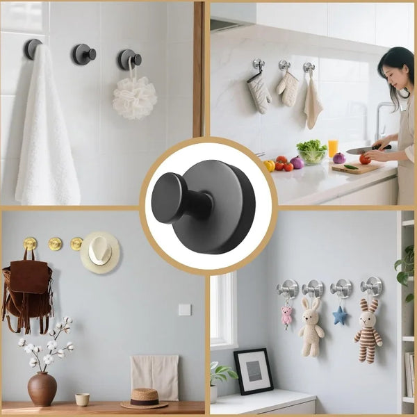 A close-up view of a black stainless steel suction cup hook used as a no-drill towel holder on a white tiled wall.