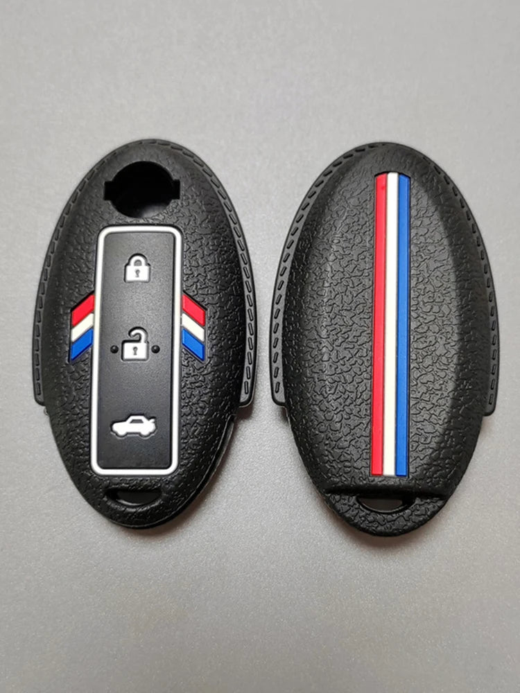 Black silicone key fob cover with a clear window showing a car silhouette and a national flag design