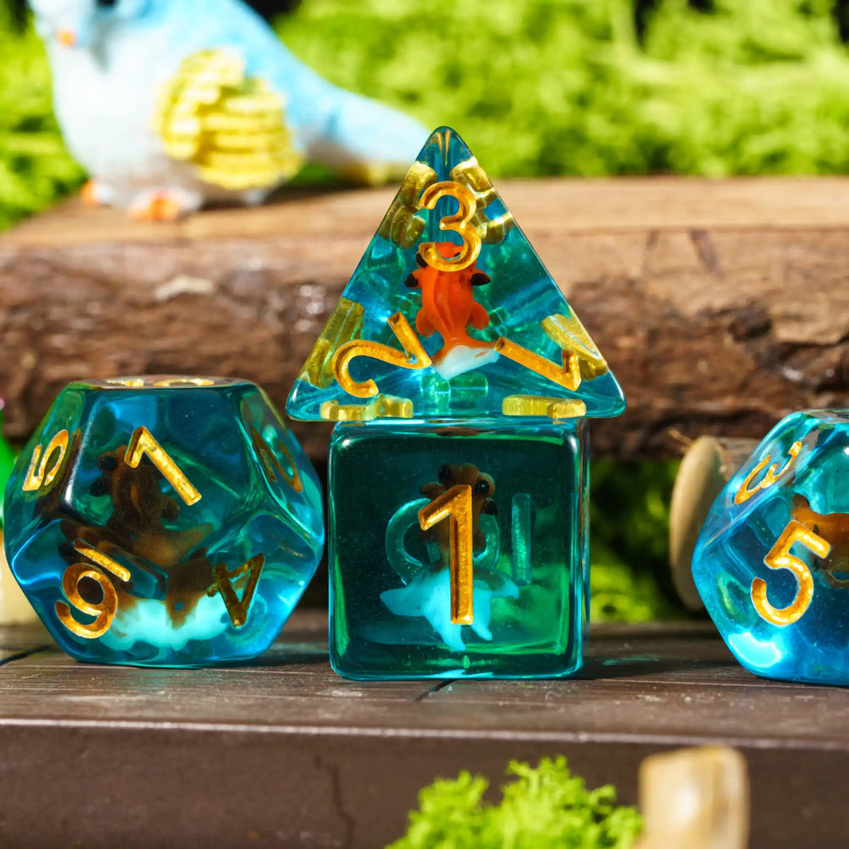 A set of resin dice featuring animal designs and numbers resting on a wooden surface.