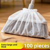 A white disposable broom cover made of sheer mesh fabric is shown on a wooden floor.