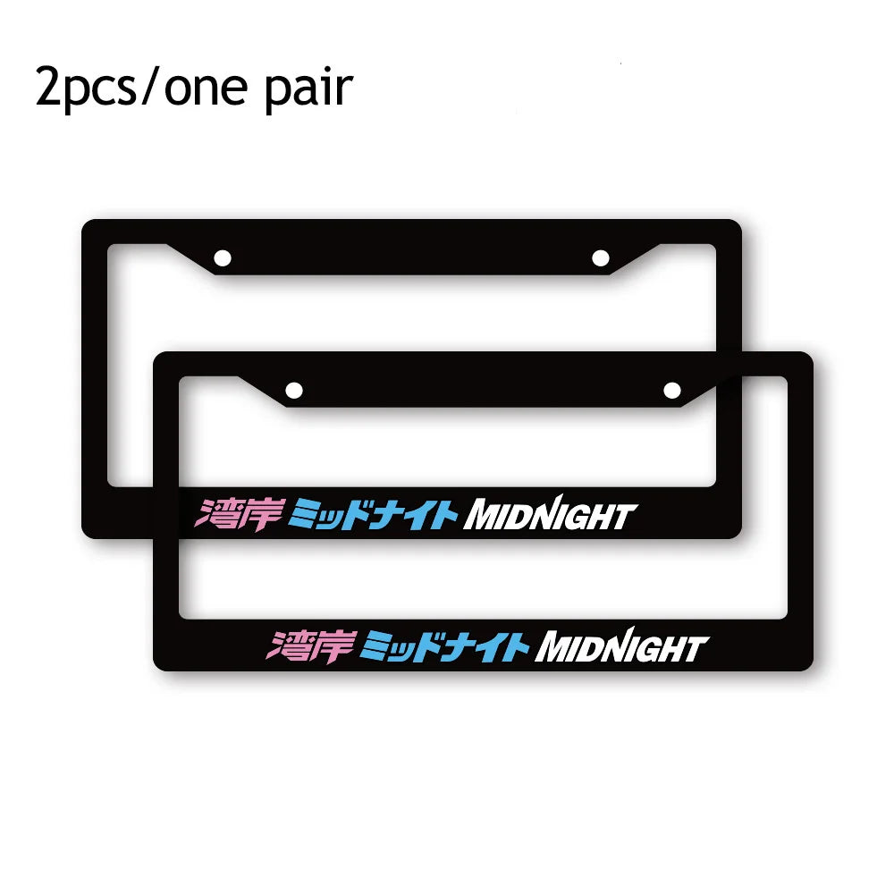 A pair of black racing style license plate frames with Midnight text.