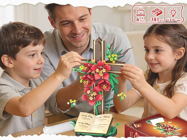 A family is assembling a floral cross building set, featuring red and yellow flowers on a wooden frame.
