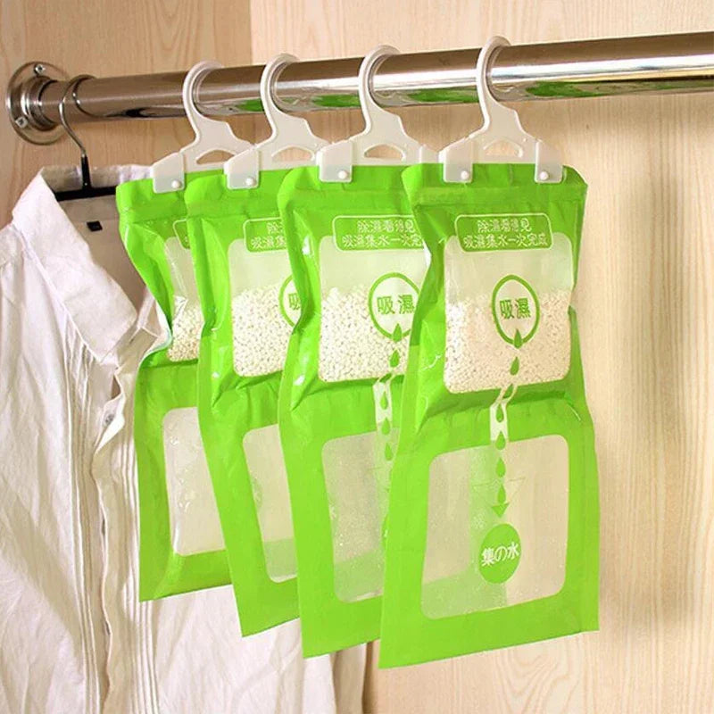 Green hanging bags filled with moisture absorbers for closets and cabinets