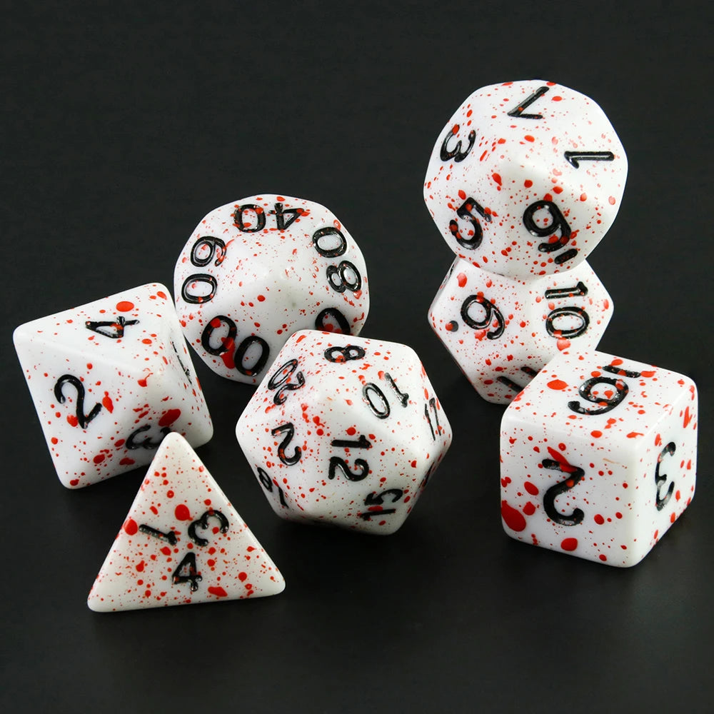 A collection of seven polyhedral dice, including a d20 and a tetrahedron, scattered on a dark surface.