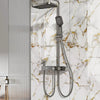 A modern silver shower system with a handheld shower head mounted on a marble-patterned wall.