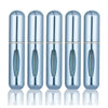 A set of five silver-colored, cylindrical perfume spray bottles lined up against a white background.