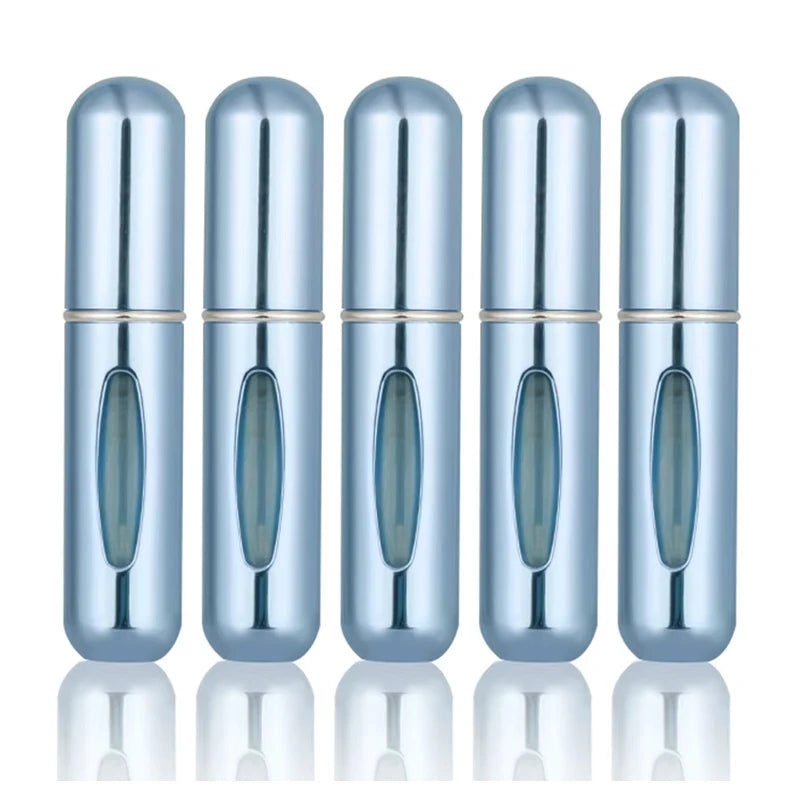 A set of five silver-colored, cylindrical perfume spray bottles lined up against a white background.