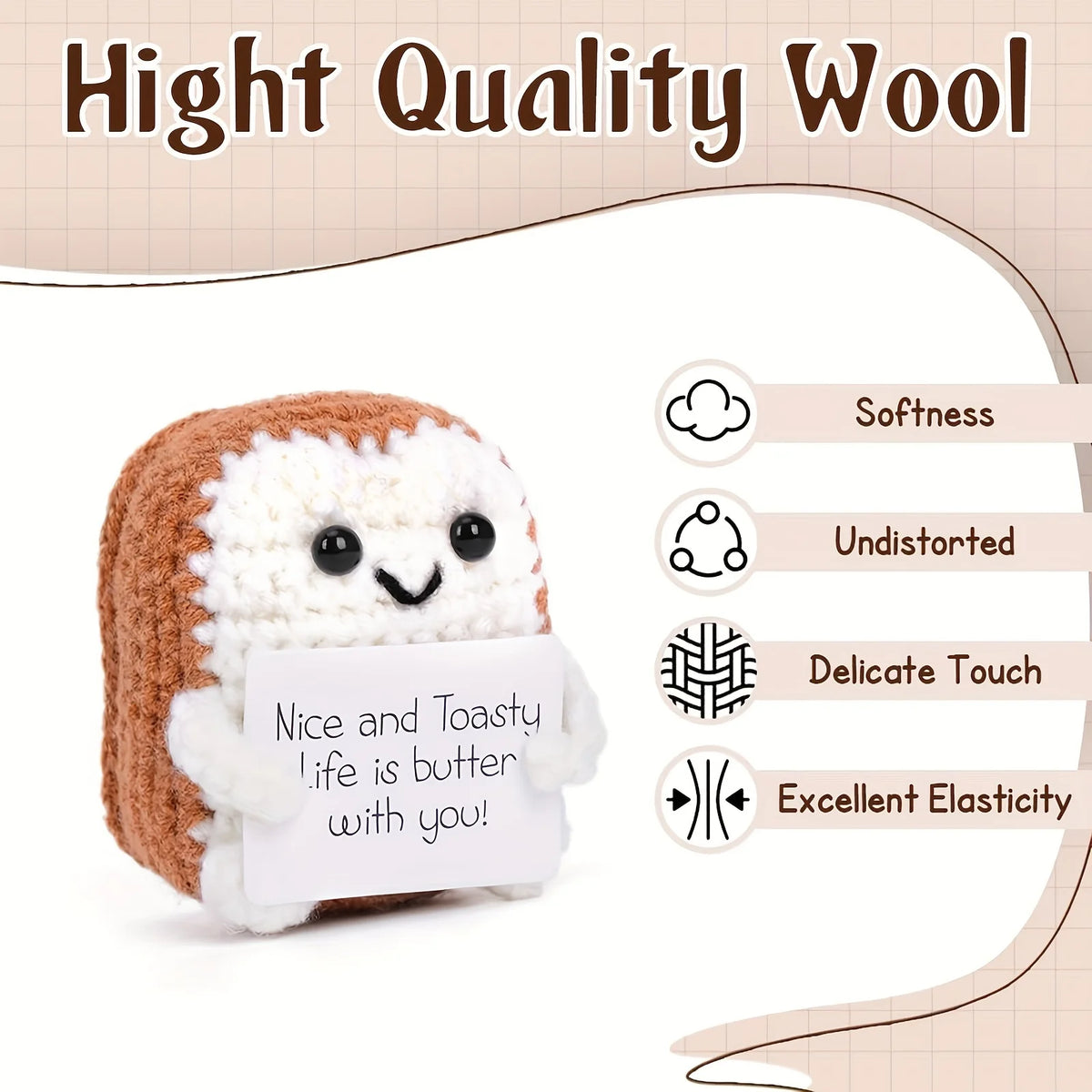 A brown and white crocheted plush ornament shaped like a loaf of bread with a handwritten note attached.