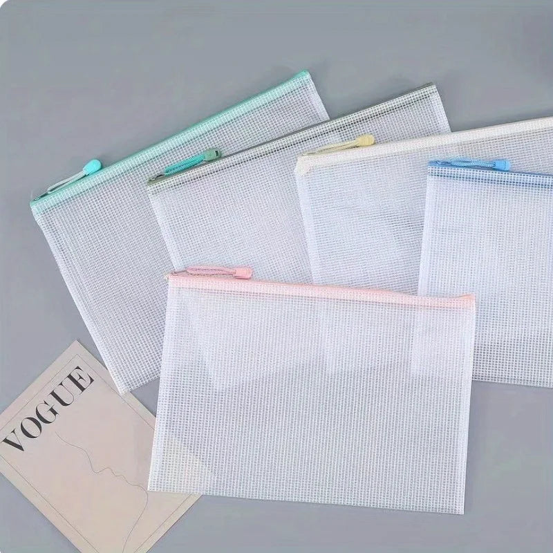 A set of ten clear mesh zipper bags for classroom and craft organization
