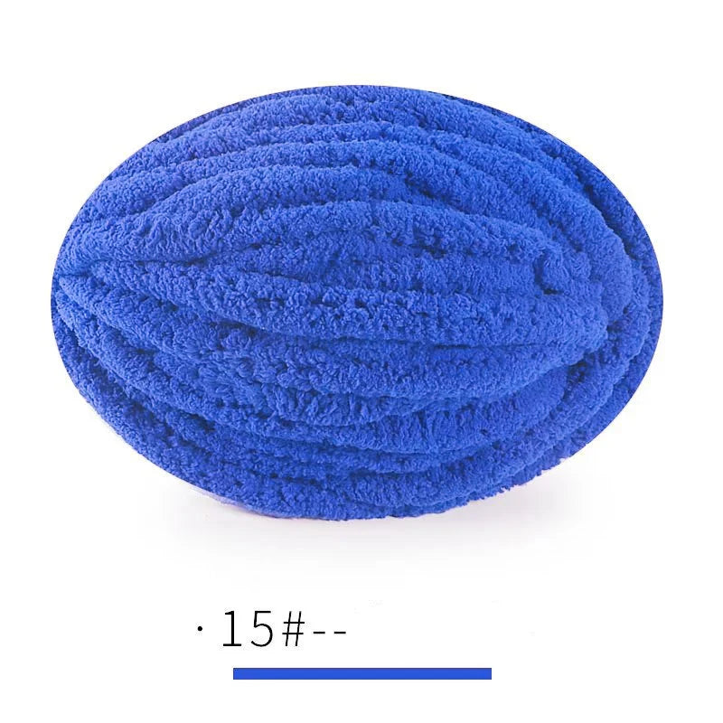 A ball of bright blue extra thick chenille yarn for hand knitting projects.