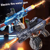 A close-up of an electric fire water gun replica with a continuous stream of water firing from the barrel.