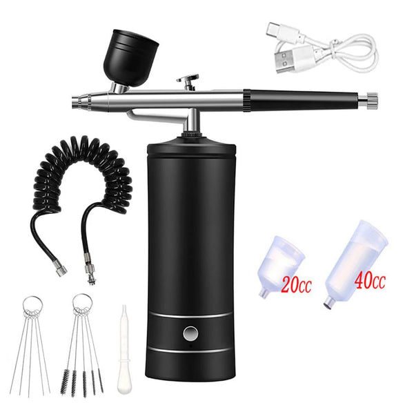 Portable rechargeable nail airbrush kit showing the main unit, tubing, and four different sized nozzles.