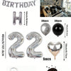 A kit for a balloon garland featuring silver and black foil numbers and decorative balloons.