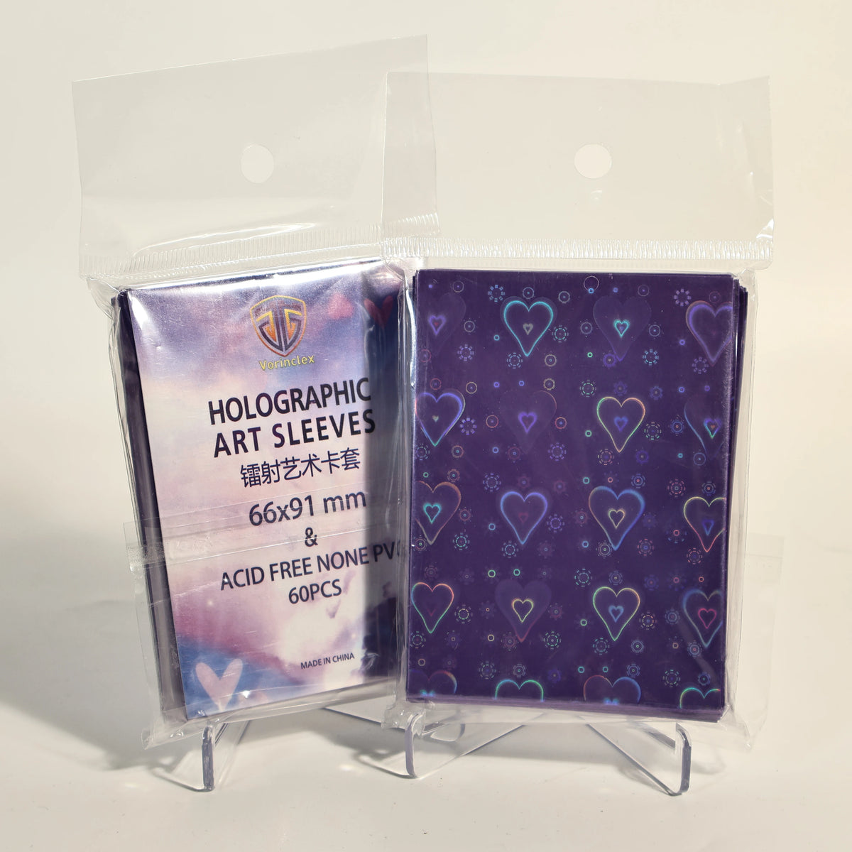 A package of 60 holographic heart-shaped art card sleeves in purple and blue colors.