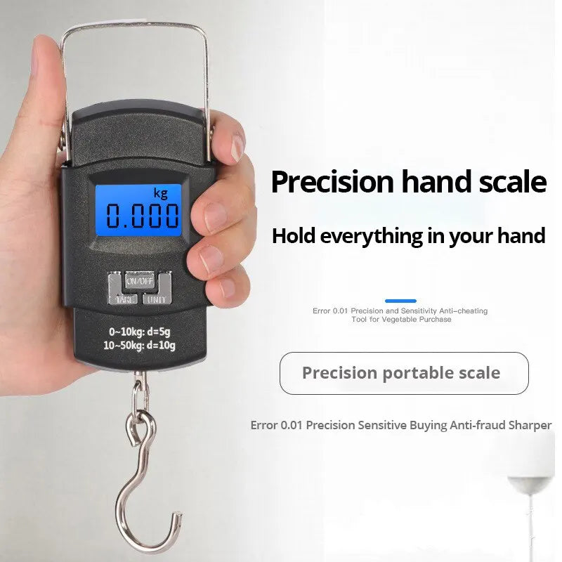 A hand holding a black precision portable scale with an LCD display, used to measure weight.