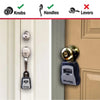 A close-up view of a portable combination key safe with a weather-resistant metal body installed on a door.