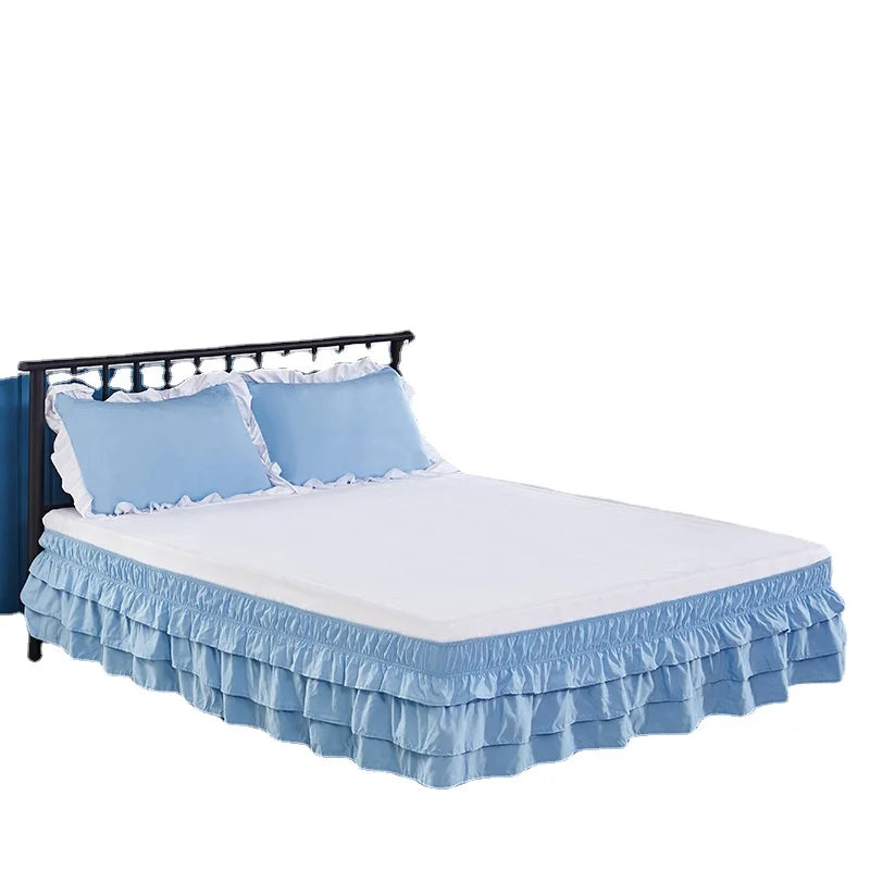 Light blue adjustable elastic bed skirt wrapping around a mattress to hide under-bed space